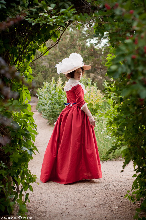 V195: Red Dress in The Garden